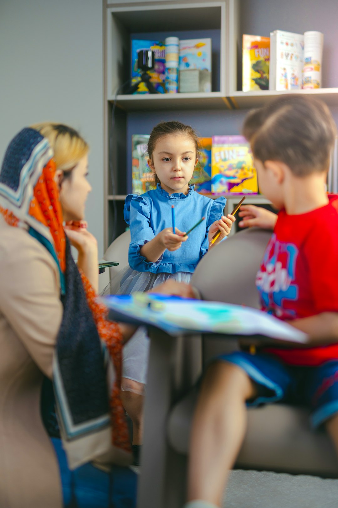Children learning English with a teacher in an ESL classroom environment