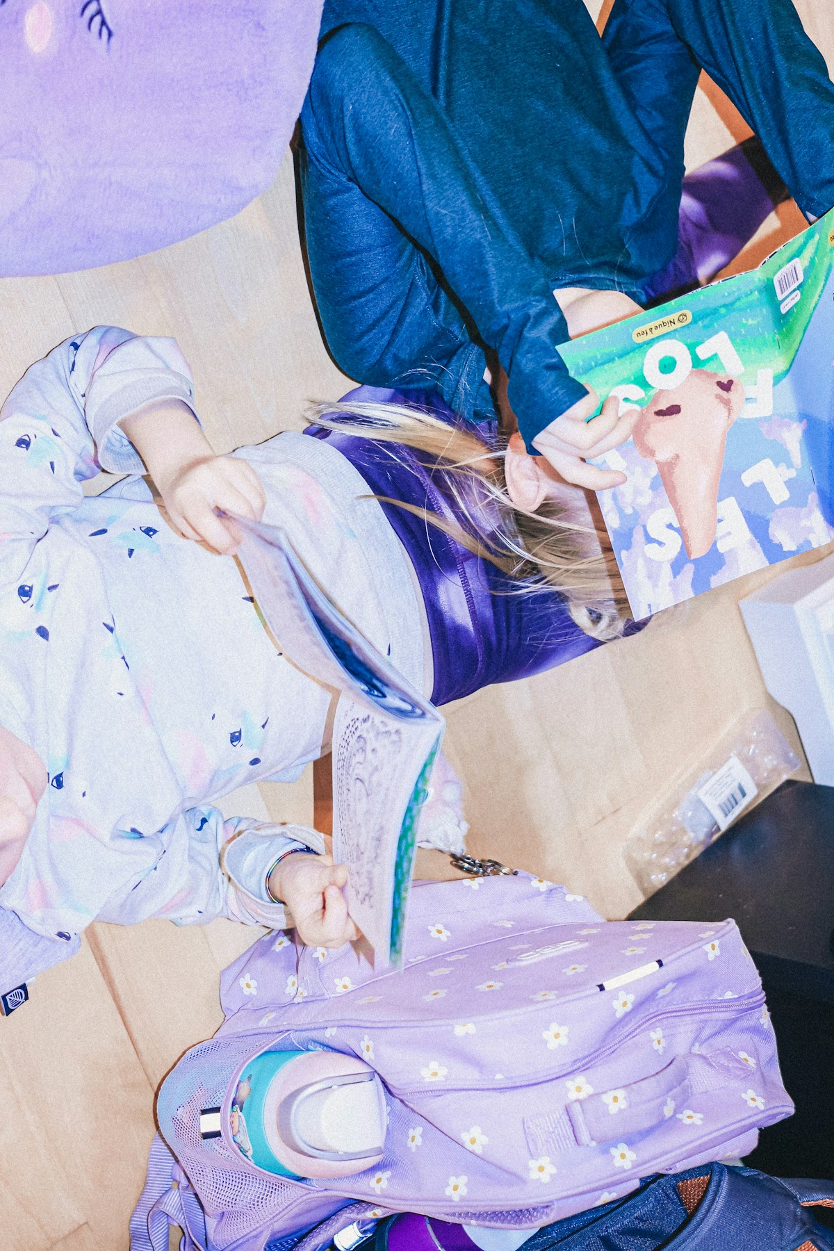 Children reading books together and building vocabulary through context clue strategies