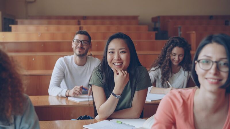 ESL students laughing during a fun icebreaker activity in class
