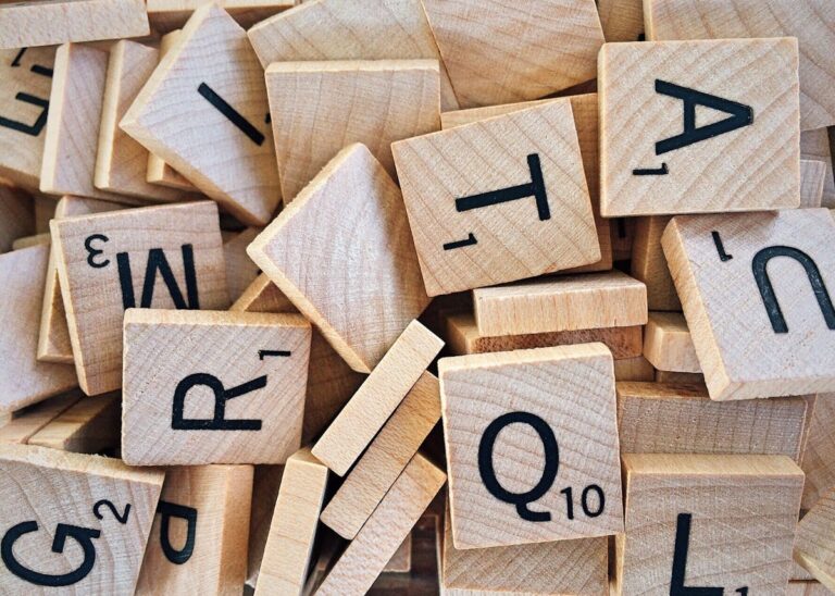 ESL vocabulary games with Scrabble letter tiles for word building and spelling practice