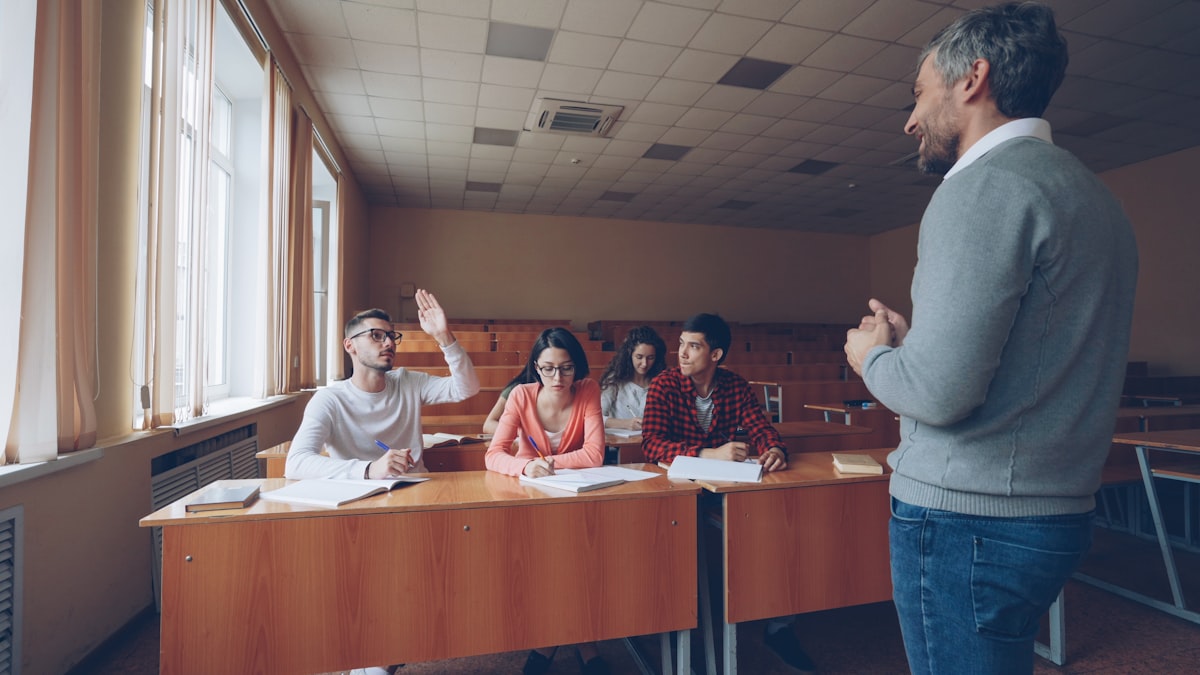 ESL teacher interacting with students during a speaking activity