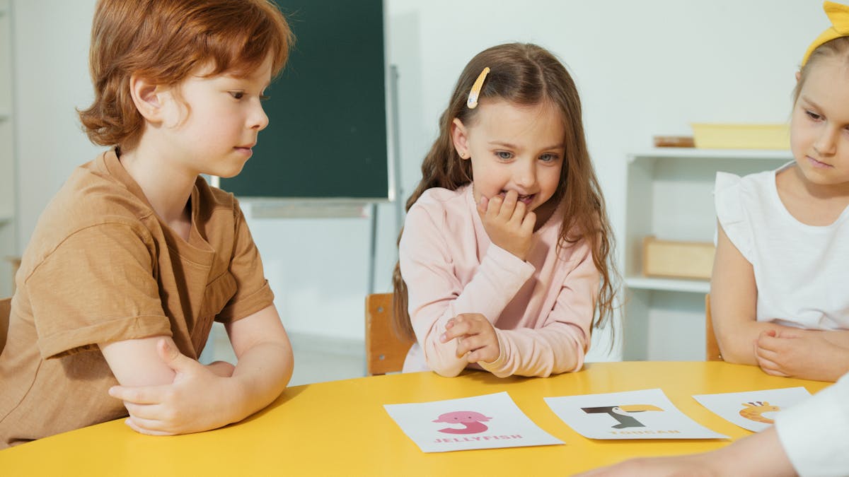 Students playing a group vocabulary card game in an ESL classroom