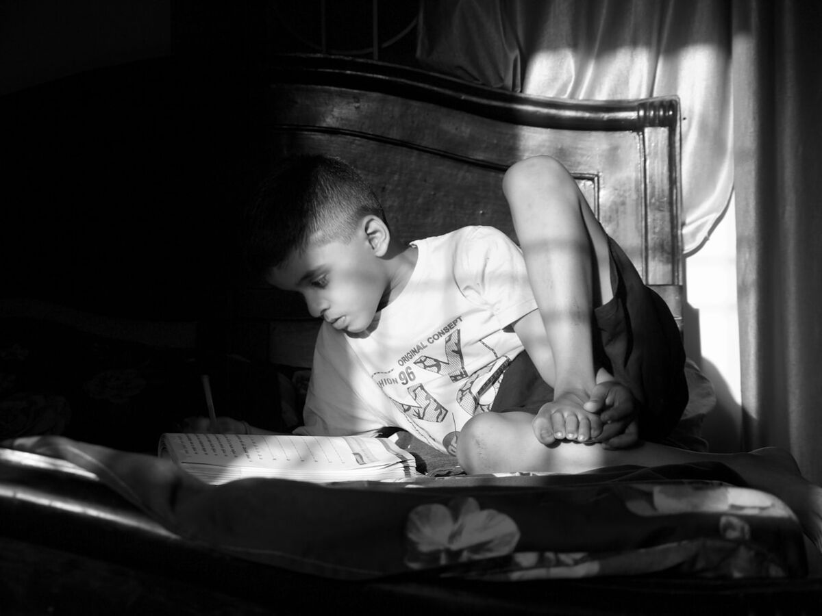 Students reading books in ESL classroom
