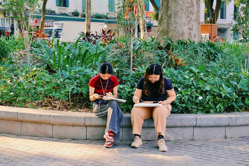 ESL students taking notes during a listening comprehension exercise