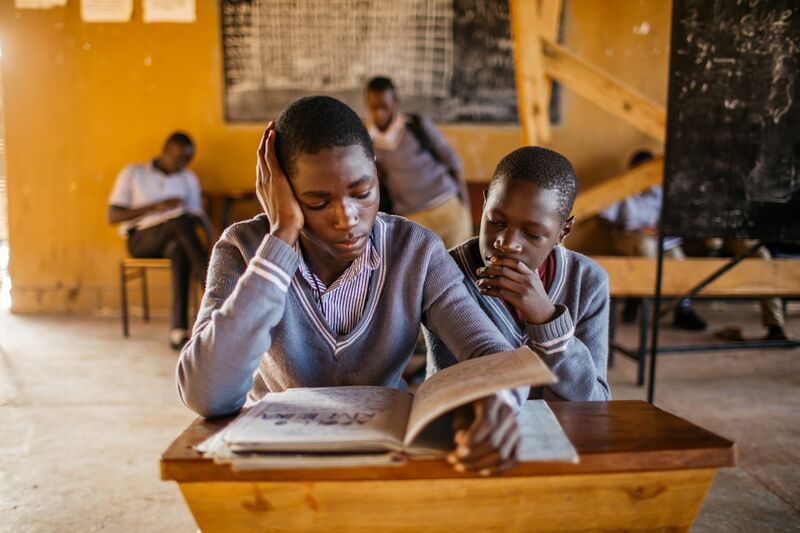 Students reading books in ESL classroom