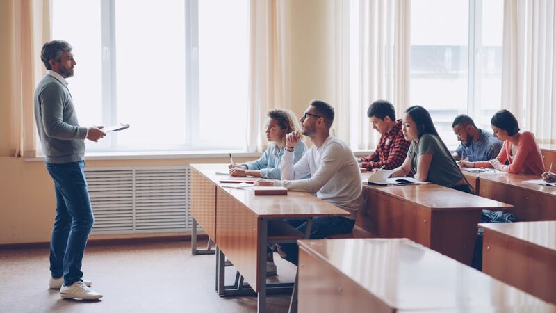 Teacher demonstrating listening skills techniques in ESL classroom