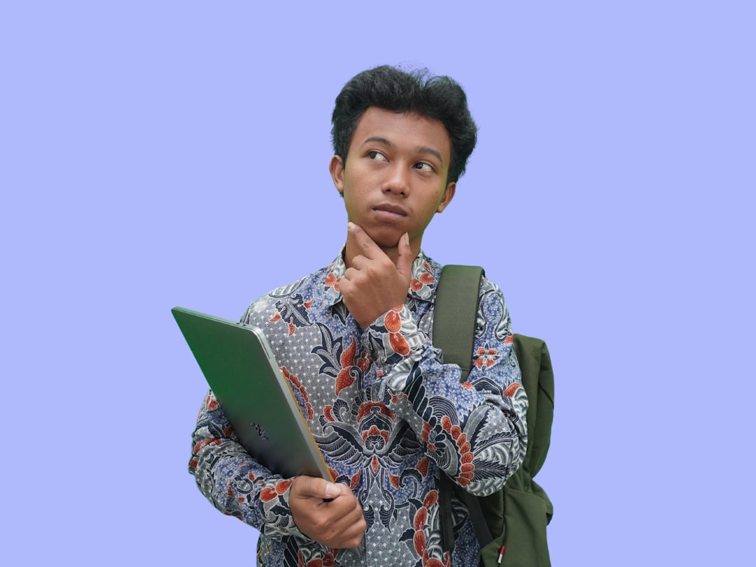 Indonesian College Students Wearing Batik Confused Thinking Pose