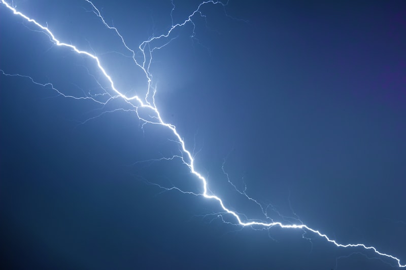 Lightning bolt in dark sky illustrating bolt from the blue idiom