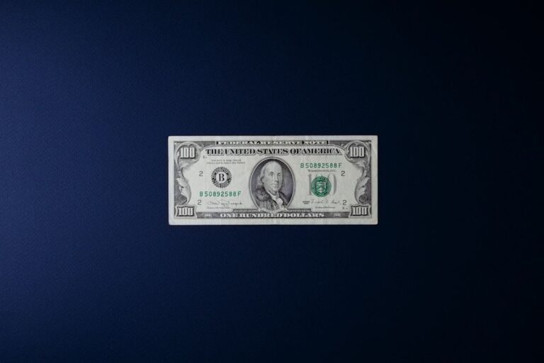 English idioms about money featured image showing dollar bills and coins