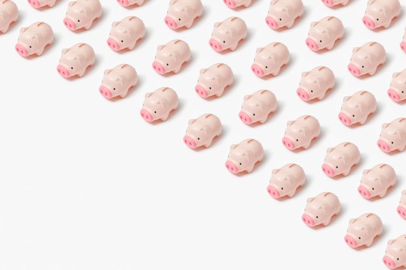 Saving for a rainy day idiom illustrated with a piggy bank and savings