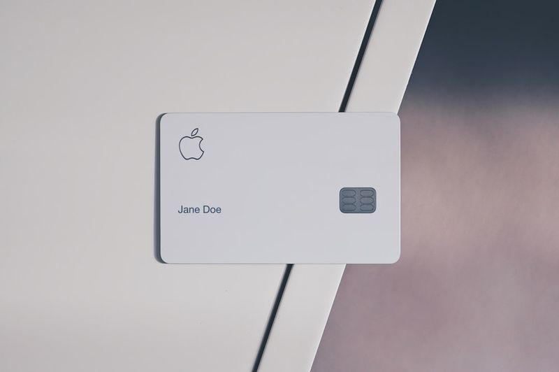 Foot the bill idiom shown with wallet and credit card payment