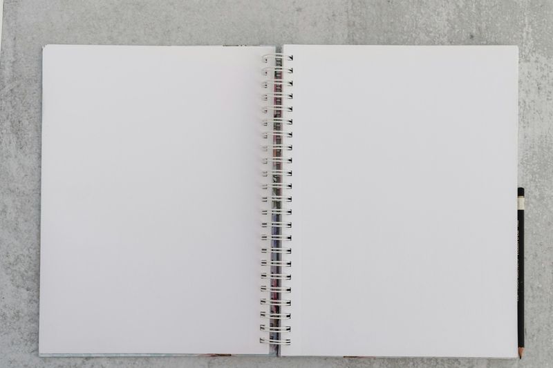 ESL lesson plan template printed in a notebook on a desk