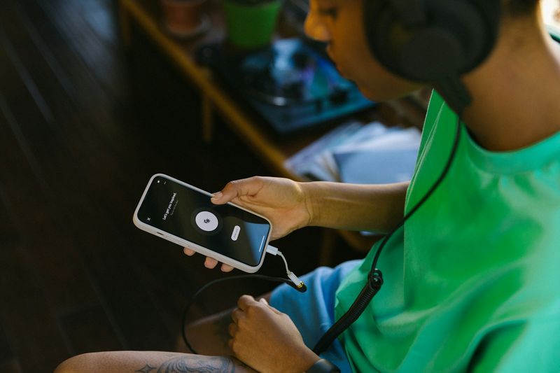 Student using smartphone for mobile ESL listening activity