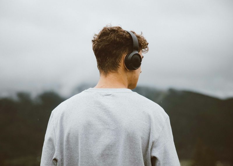 Student wearing headphones for ESL listening practice