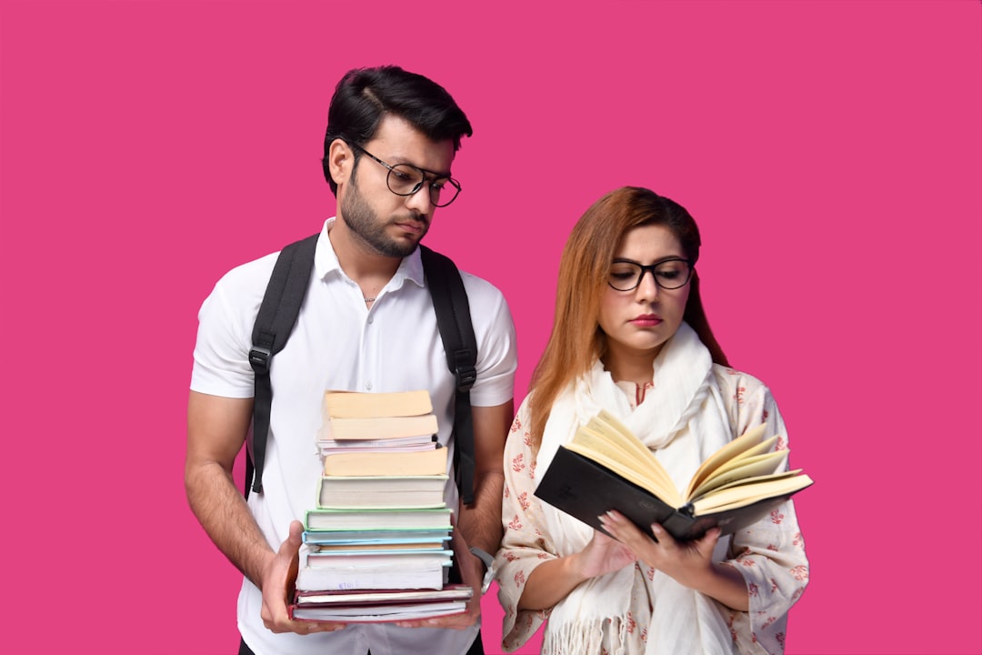 a man and a woman holding books