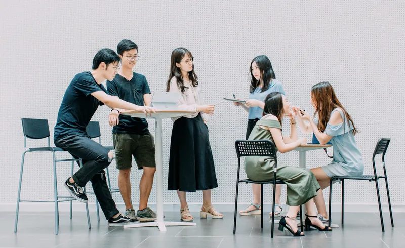 ESL students collaborating in a group during a no-prep mixed-level classroom activity