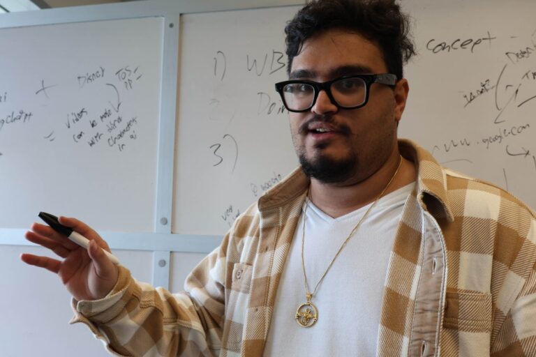 ESL teacher presenting scaffolding strategies on whiteboard to engaged students