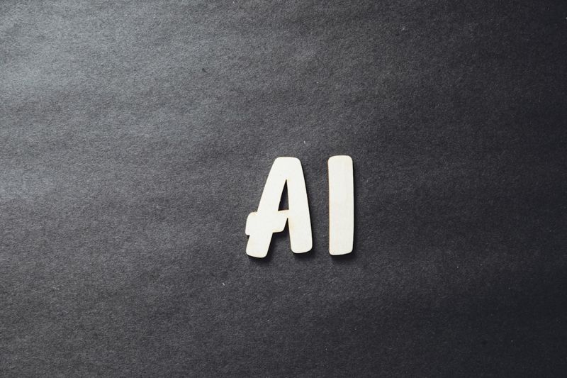 AI letters on a dark background representing artificial intelligence in ESL education