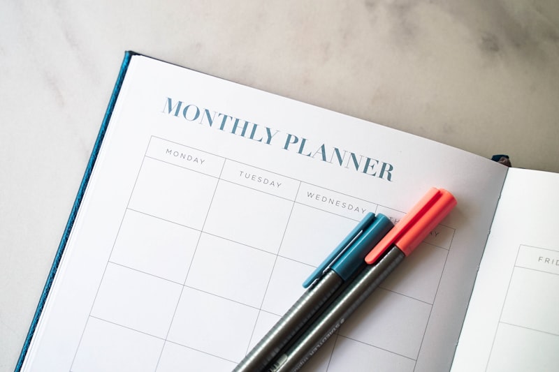 Backward design lesson plan template with monthly planner and pens