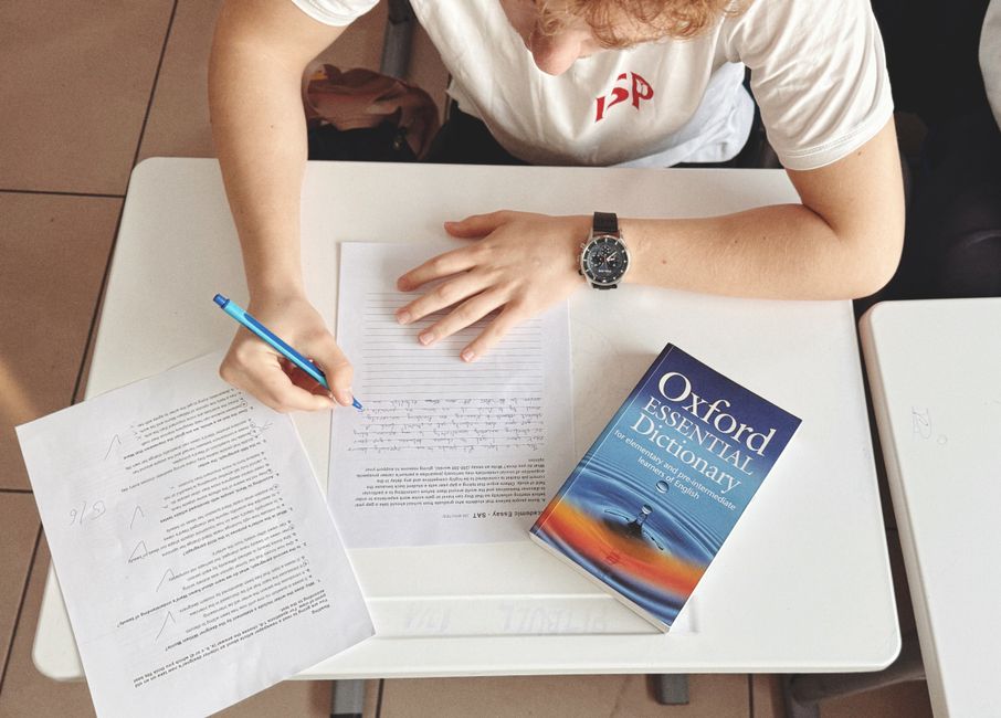 Advanced student working on academic English writing