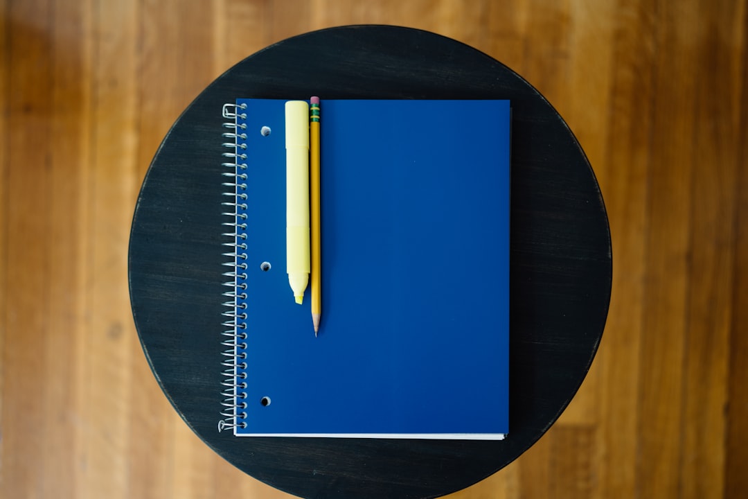 notebook with a pencil and eraser on it