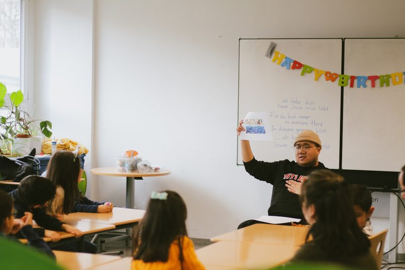 ESL classroom rules shown visually on whiteboard