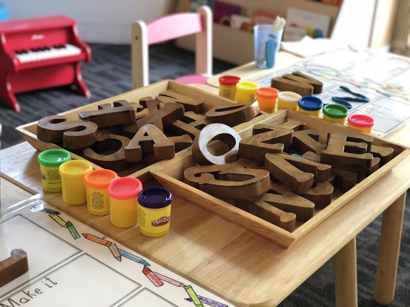 Wooden alphabet letters used for ESL flashcard activities with young learners