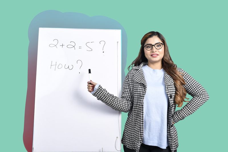 ESL scaffolding examples in teaching: target grammar prompts on a classroom whiteboard