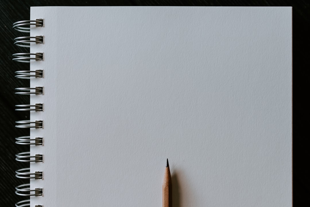 Wooden pencil on blank spiral notebook