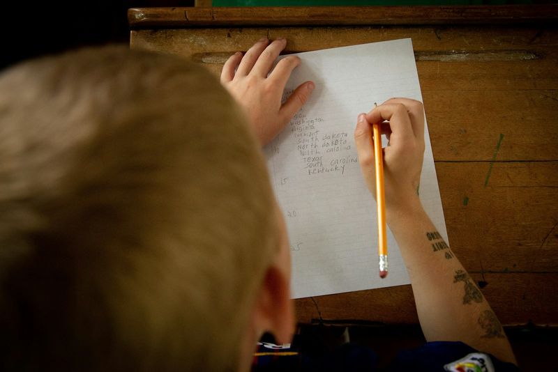 A student completing an exit ticket formative assessment