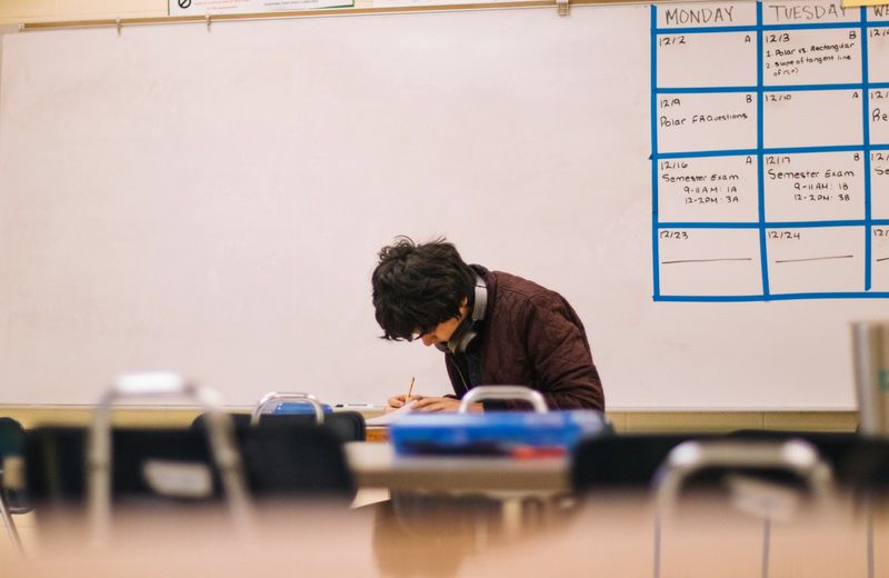 Student writing as a teacher plans responsive formative assessment