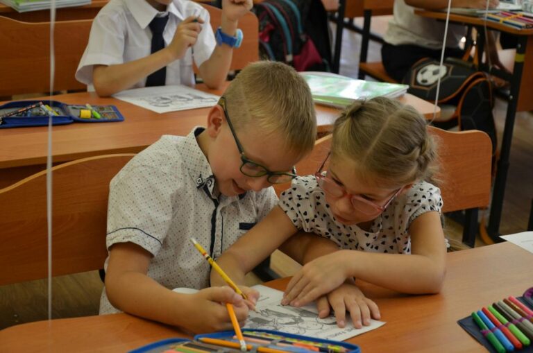 Two students collaborating in a classroom, a growth mindset in action
