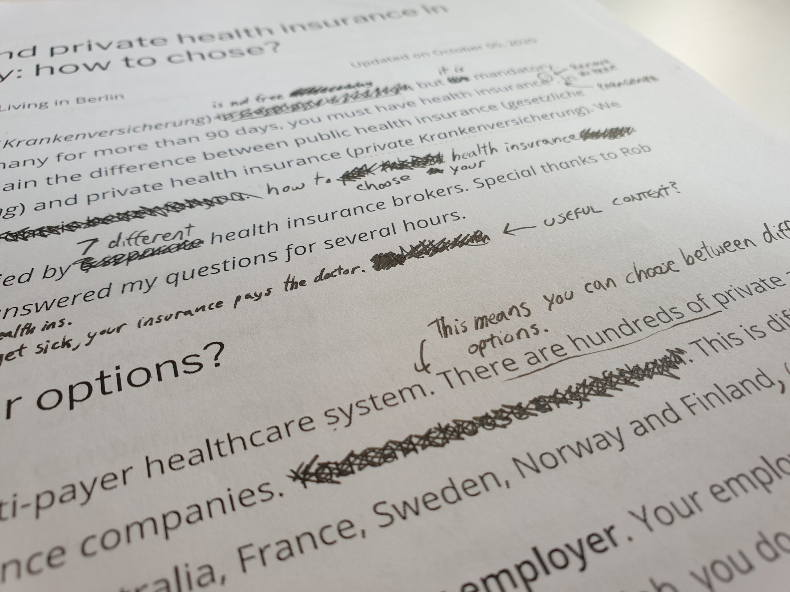 Pen revisions on a paper document — iterating and editing a first draft
