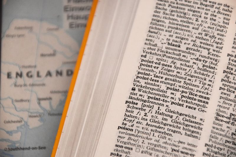 English dictionary open to a page of phrasal verbs definitions