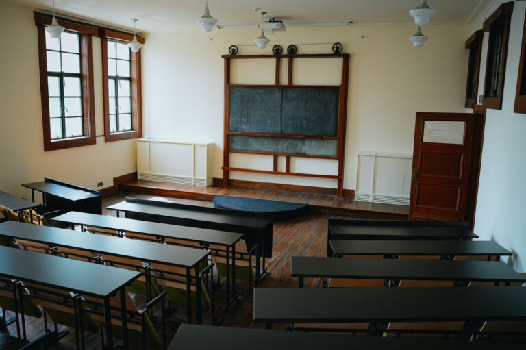 Empty classroom with chalkboard symbolising reflective teaching