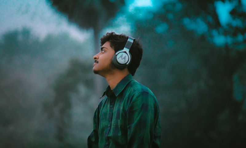 ESL student listening to minimal pairs audio with headphones