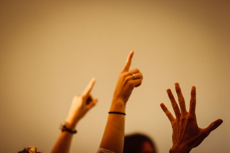 ESL students raising hands to answer instruction checking questions