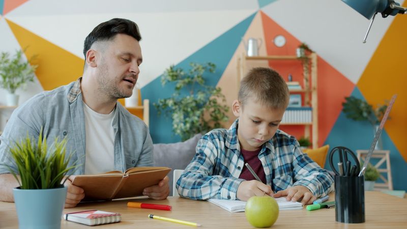 Reading aloud with a young English learner during a lesson