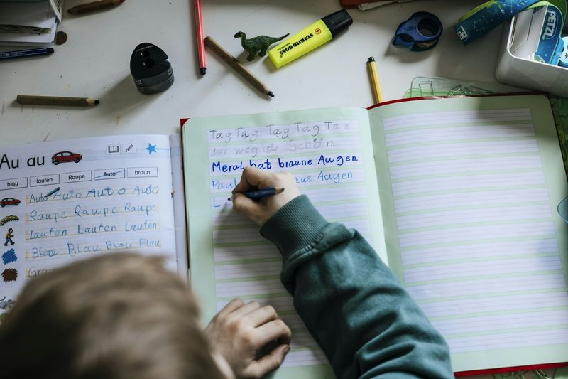 Young learner practicing English handwriting and spelling