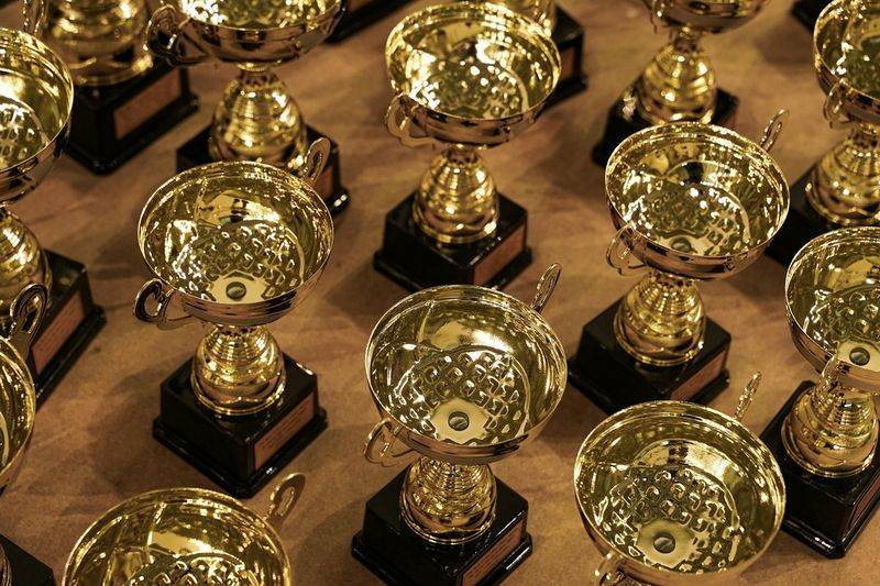 Trophies representing rewards and badges in a gamified ESL classroom
