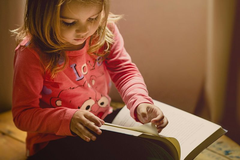 ESL student reading before entering writing competitions for kids