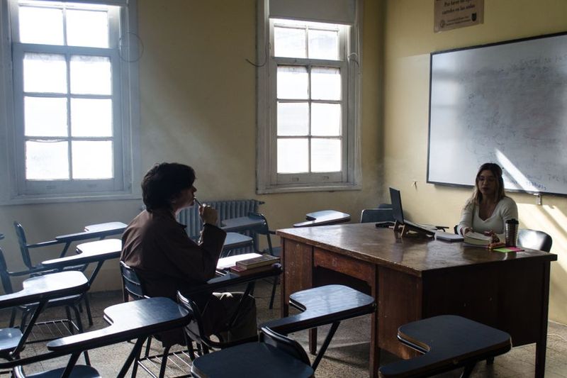 ESL students conversing and debating in pairs