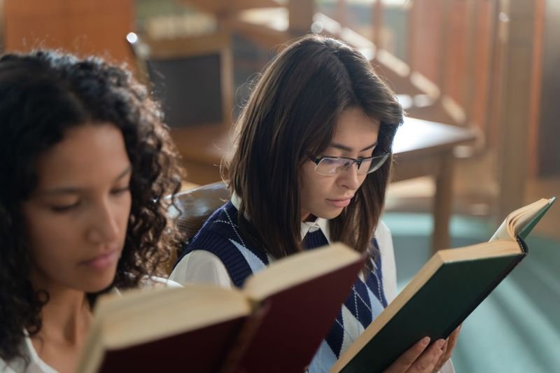 ESL students reading books together in a classroom reading activity