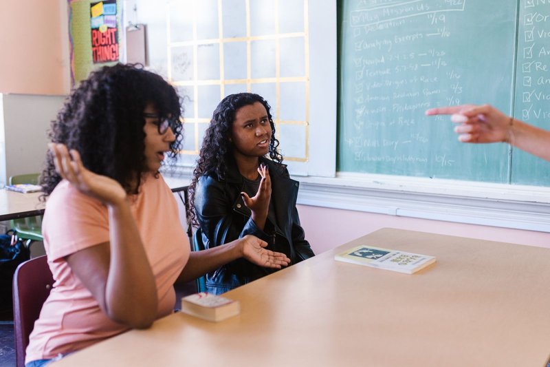 ESL teacher using gesture to reinforce meaning, a core TPR principle