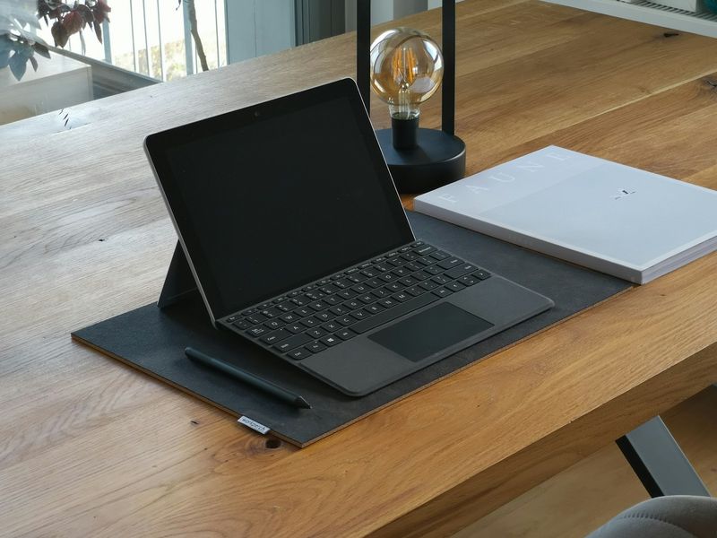 Tablet and notebook set up for reading and digital ESL writing practice