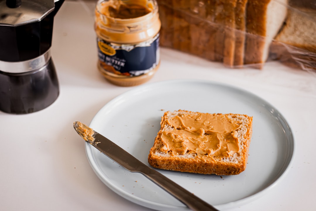 Spreading butter on bread — buttering someone up