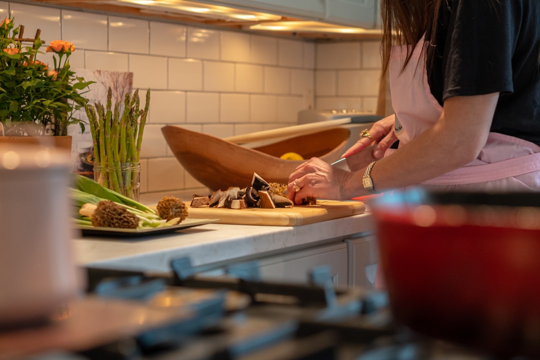 A home cook chopping fresh ingredients in the kitchen