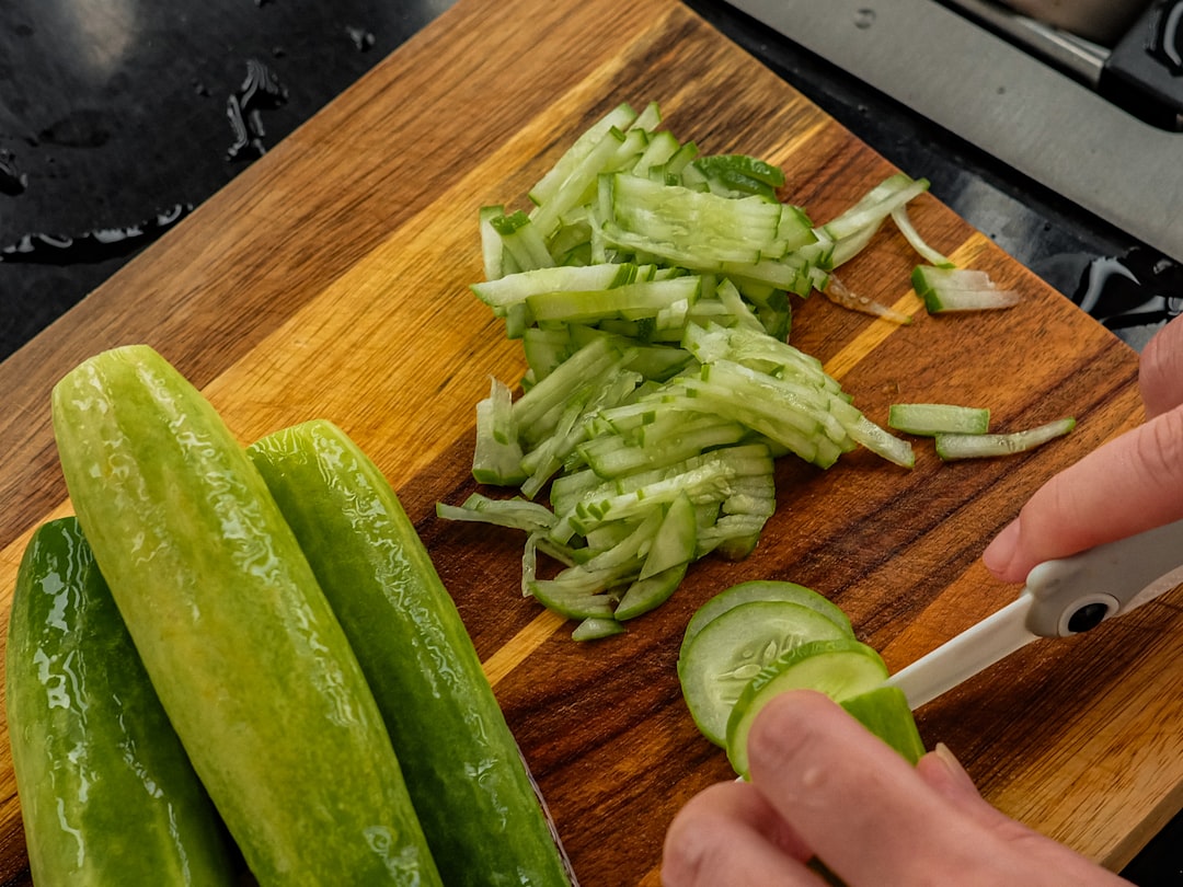 Fresh cucumber being sliced — cool as a cucumber