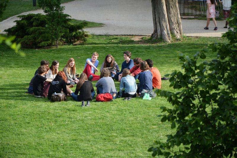 Students in a group discussion, a simple way to reduce teacher talking time