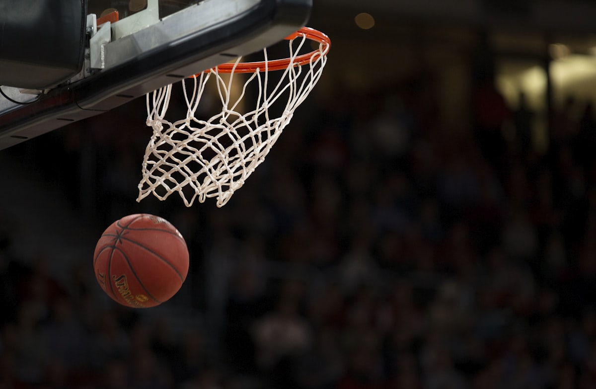 Basketball dropping through the hoop and net, illustrating ball-game idioms in English